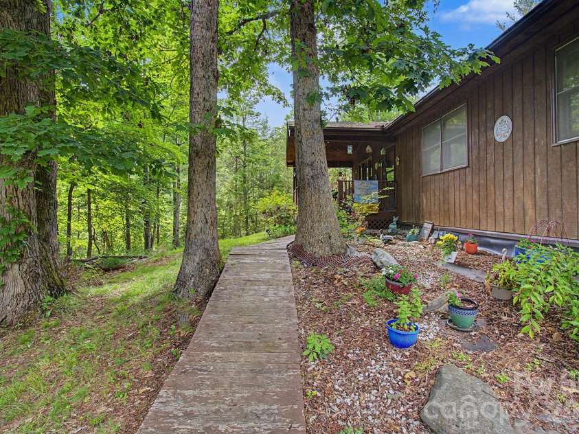 175 Pine Cove Lane, Alexander, NC 28701.  MLS# CAR4388066, YatesRealty ID 30672. Front flowerbed
