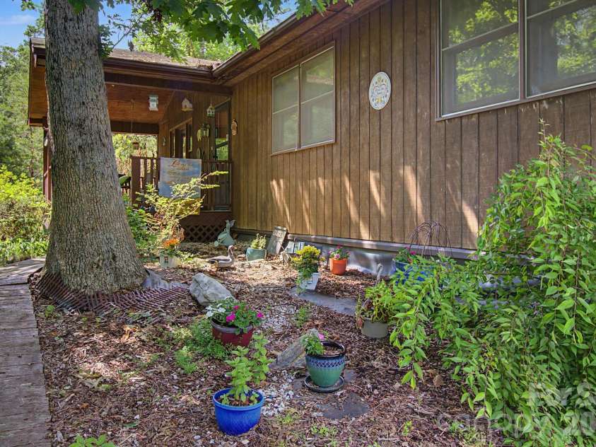 175 Pine Cove Lane, Alexander, NC 28701.  MLS# CAR4388066, YatesRealty ID 30672. Front flowerbed