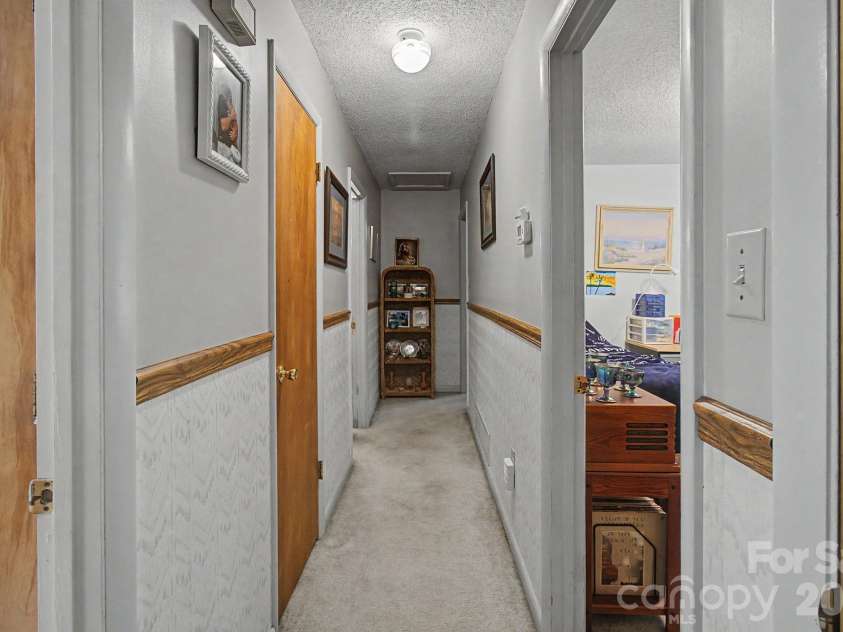 175 Pine Cove Lane, Alexander, NC 28701.  MLS# CAR4388066, YatesRealty ID 30672. Hallway to bedrooms