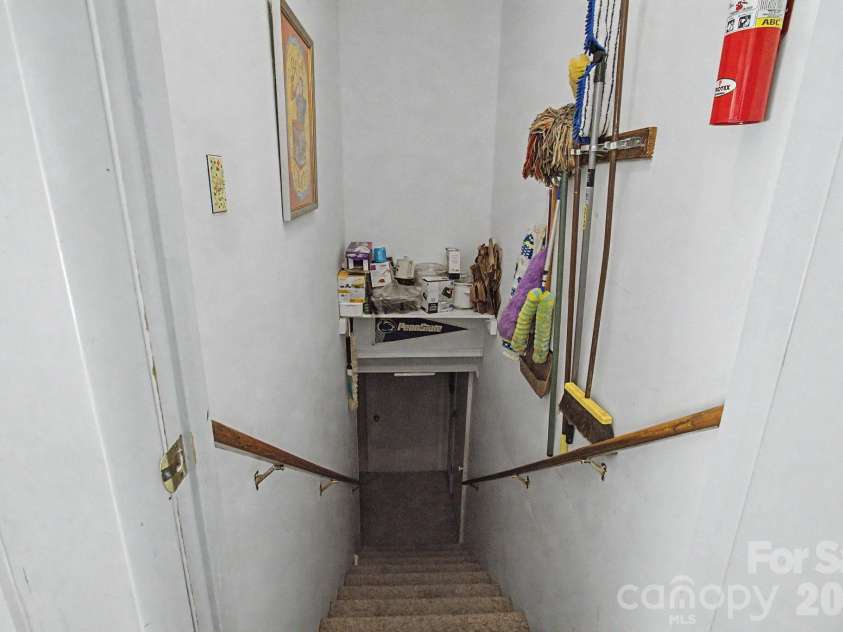 175 Pine Cove Lane, Alexander, NC 28701.  MLS# CAR4388066, YatesRealty ID 30672. Stairs to basement