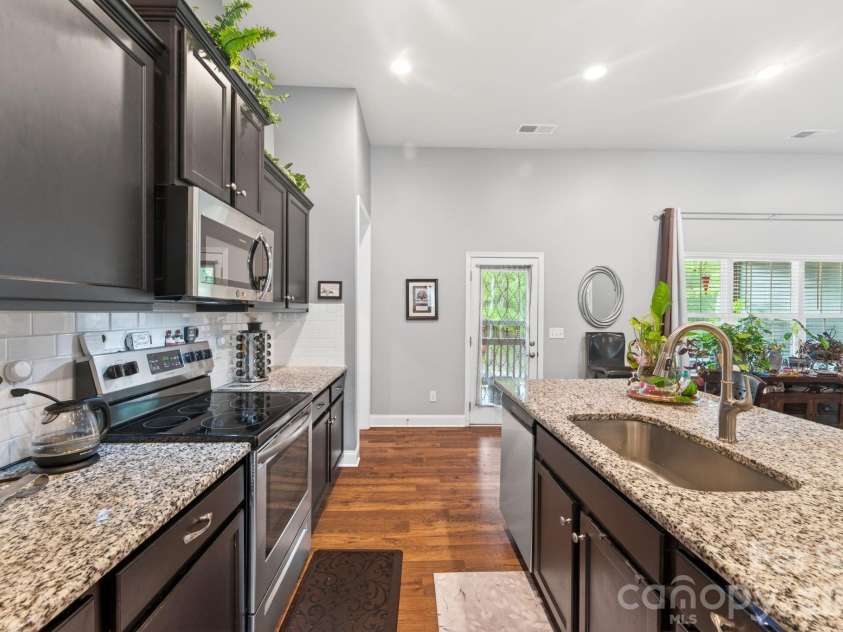 207 Vanderbilt Boulevard, Locust, NC 28097.  MLS# CAR4371476, YatesRealty ID 30677. Kitchen