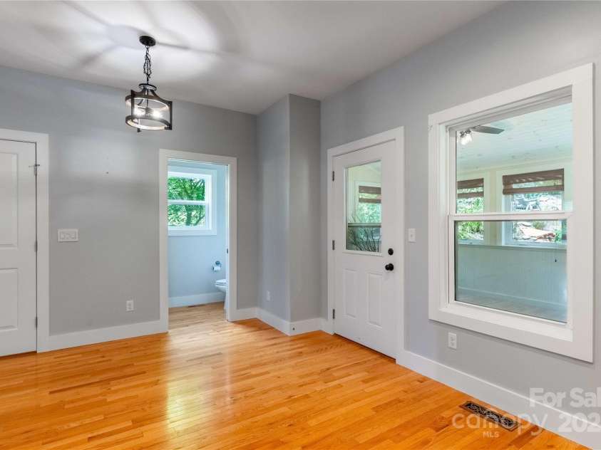 5 Koenig Way, Asheville, NC 28804.  MLS# CAR4280267, YatesRealty ID 3068. View from kitchen toward 1/2 bath. Sunroom on right.