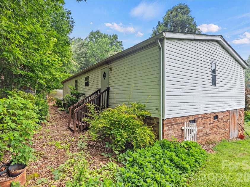 323 Carlyle Road, Troutman, NC 28166.  MLS# CAR4381311, YatesRealty ID 30683. Back of the home