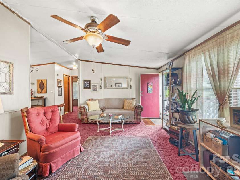 323 Carlyle Road, Troutman, NC 28166.  MLS# CAR4381311, YatesRealty ID 30683. Large windows allow lots of natural light.