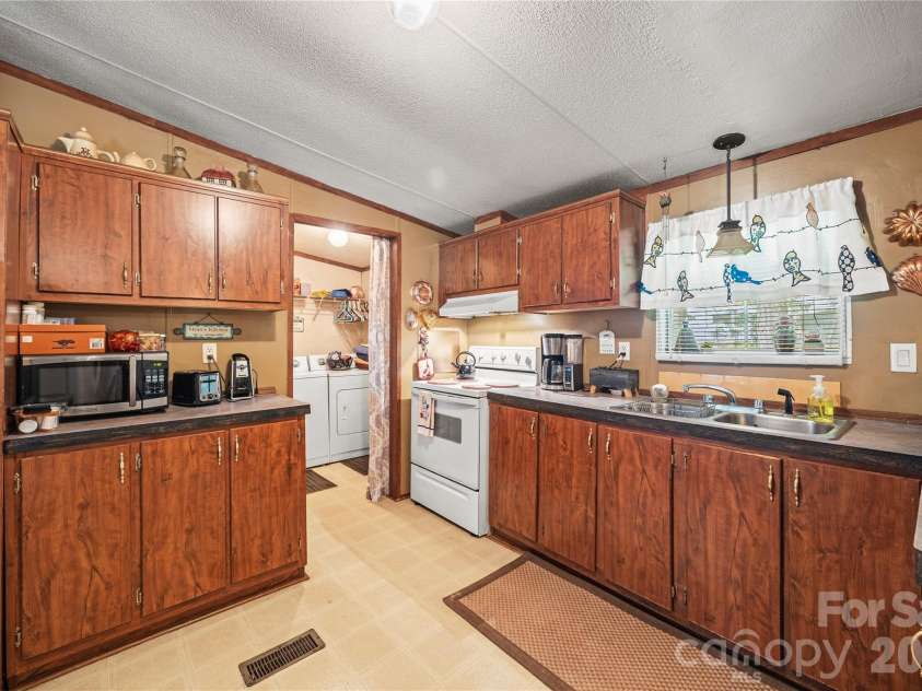 323 Carlyle Road, Troutman, NC 28166.  MLS# CAR4381311, YatesRealty ID 30683. Lots of storage in this kitchen.