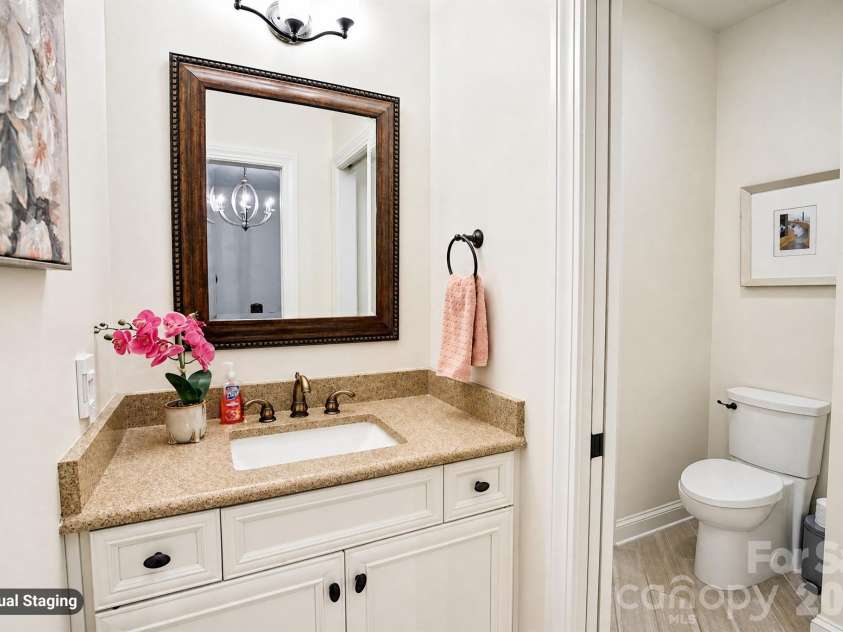 880 Hickory Stick Drive, Fort Mill, SC 29715.  MLS# CAR4379413, YatesRealty ID 30693. Bedroom 3 Vanity with shared bathroom & shower