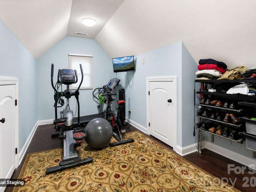 880 Hickory Stick Drive, Fort Mill, SC 29715.  MLS# CAR4379413, YatesRealty ID 30693. Primary Closet Exercise area & Storage Access