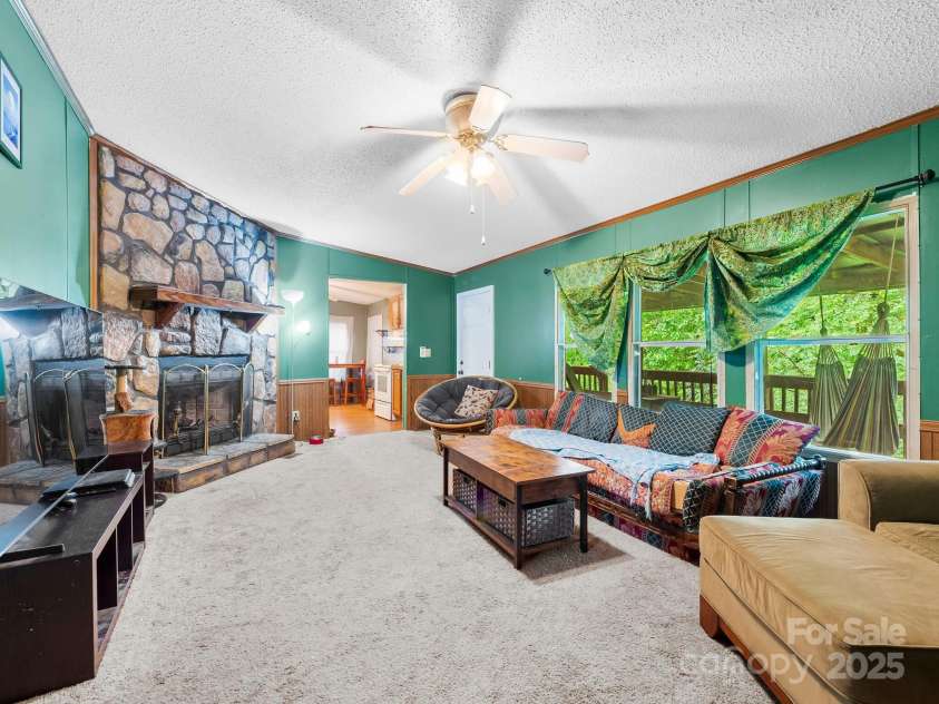 238 Brickyard Road, Asheville, NC 28806.  MLS# CAR4279435, YatesRealty ID 30701. Wood burning fireplace in spacious living room