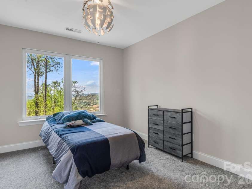 35 Chesten Mountain Drive, Asheville, NC 28803.  MLS# CAR4370920, YatesRealty ID 30701. Upper Bedroom with attached Bath