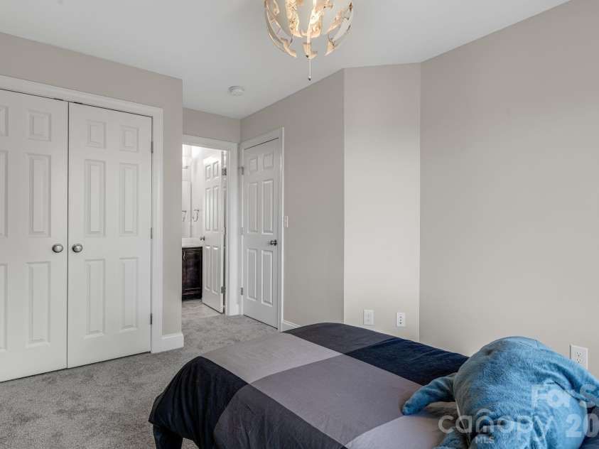 35 Chesten Mountain Drive, Asheville, NC 28803.  MLS# CAR4370920, YatesRealty ID 30701. Upper Bedroom with attached Bath