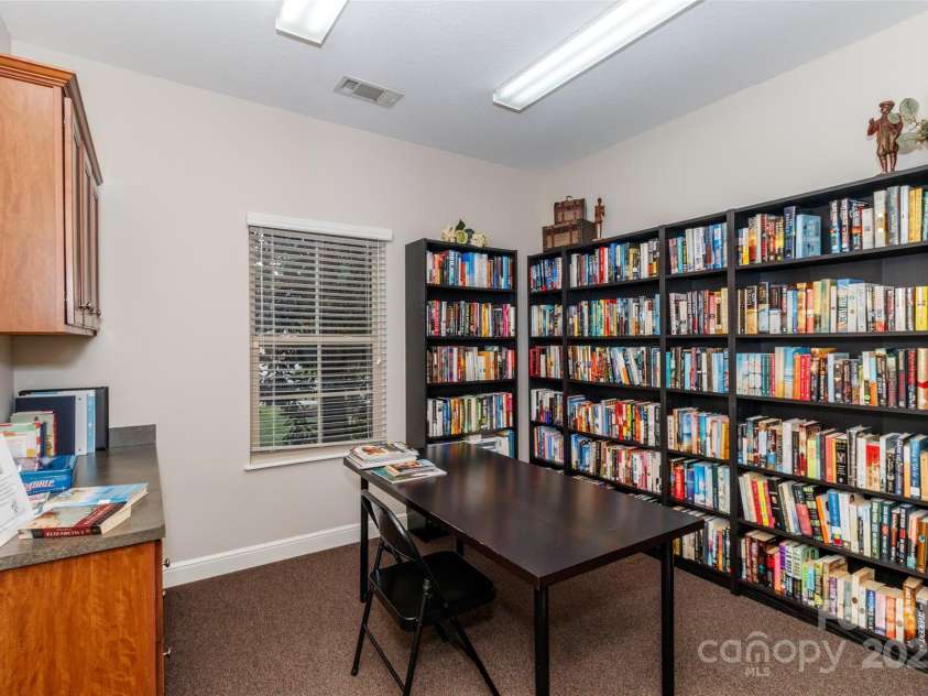4423 Parkgate Drive, Matthews, NC 28105.  MLS# CAR4286068, YatesRealty ID 30702. Clubhouse Library