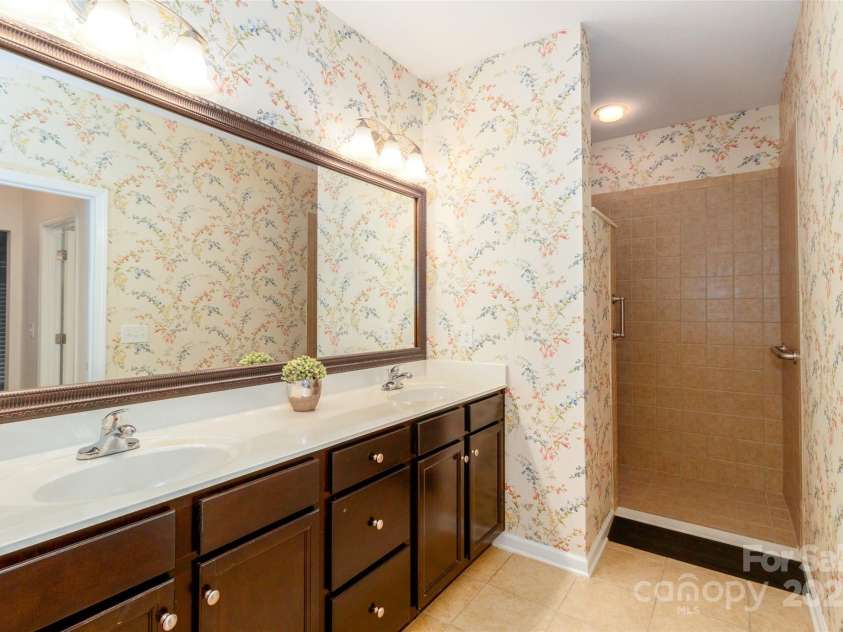 4423 Parkgate Drive, Matthews, NC 28105.  MLS# CAR4286068, YatesRealty ID 30702. Wallpaper being removed this week