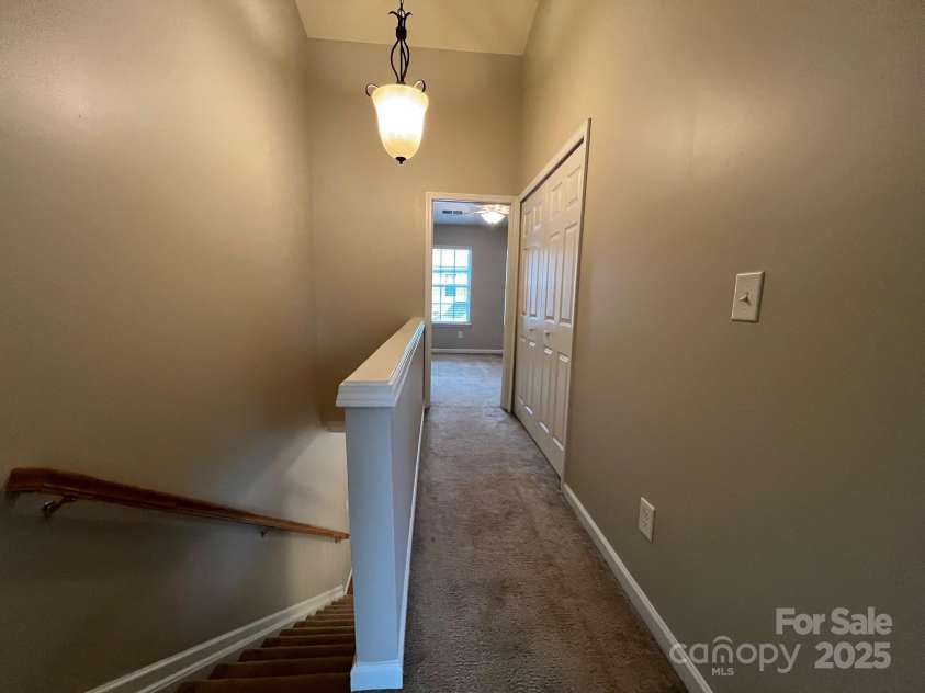 155 Limerick Road, Mooresville, NC 28115.  MLS# CAR4284761, YatesRealty ID 30708. In the hallway between the 2 bedrooms is the laundry closet.