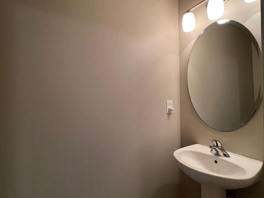 155 Limerick Road, Mooresville, NC 28115.  MLS# CAR4284761, YatesRealty ID 30708. It has a nice pedestal sink, mirror and vanity light.