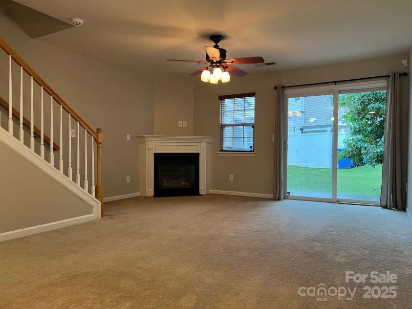 155 Limerick Road, Mooresville, NC 28115.  MLS# CAR4284761, YatesRealty ID 30708. The family room has a sliding glass door that leads to the back patio.
