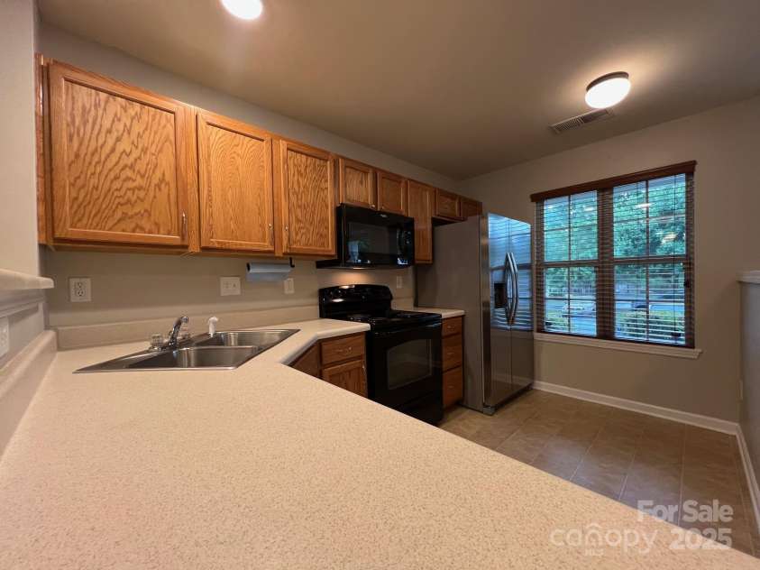 155 Limerick Road, Mooresville, NC 28115.  MLS# CAR4284761, YatesRealty ID 30708. When you enter the home, you will walk into the kitchen which has a nice double window, and a breakfast bar.