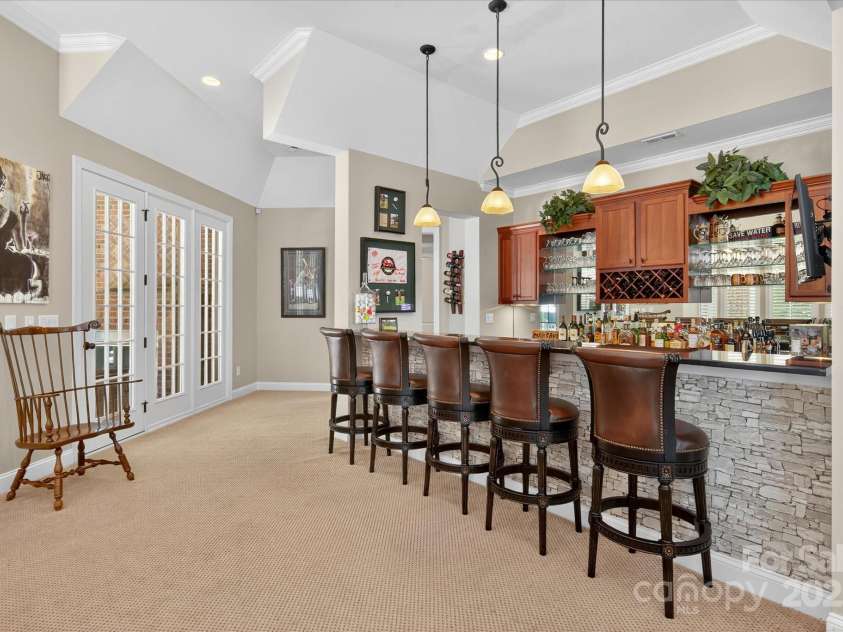 1100 Seminole Drive, Indian Land, SC 29707.  MLS# CAR4285132, YatesRealty ID 30711. Bar with beverage fridge and sink with garbage disposal