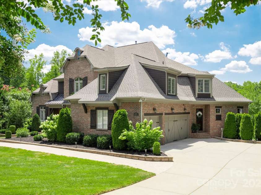 1100 Seminole Drive, Indian Land, SC 29707.  MLS# CAR4285132, YatesRealty ID 30711. Side entrance to home and 3 car side load garage on main level