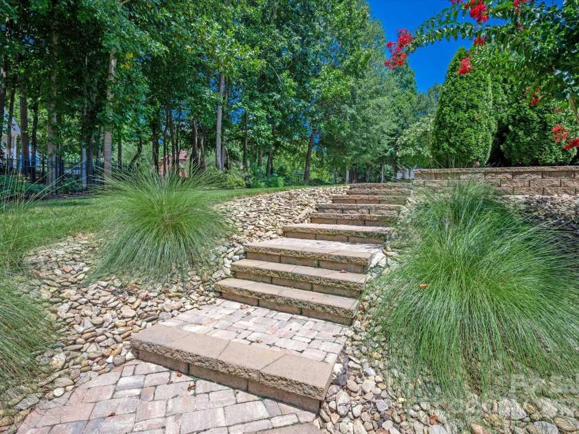 1100 Seminole Drive, Indian Land, SC 29707.  MLS# CAR4285132, YatesRealty ID 30711. Steps to backyard from the driveway