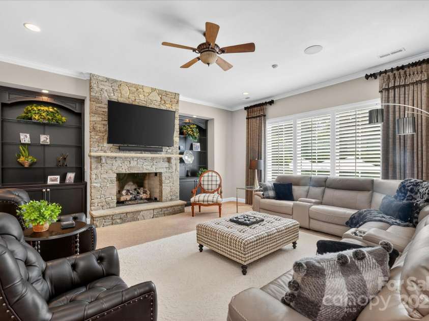 1100 Seminole Drive, Indian Land, SC 29707.  MLS# CAR4285132, YatesRealty ID 30711. Stone fireplace with built-ins in basement