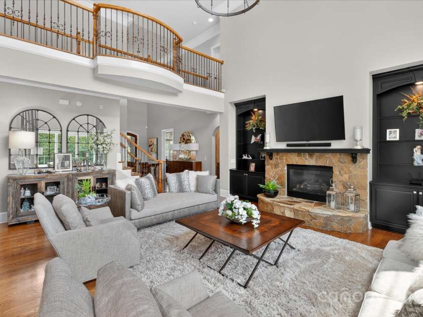 1100 Seminole Drive, Indian Land, SC 29707.  MLS# CAR4285132, YatesRealty ID 30711. Two story living room with stone fireplace and oak flooring