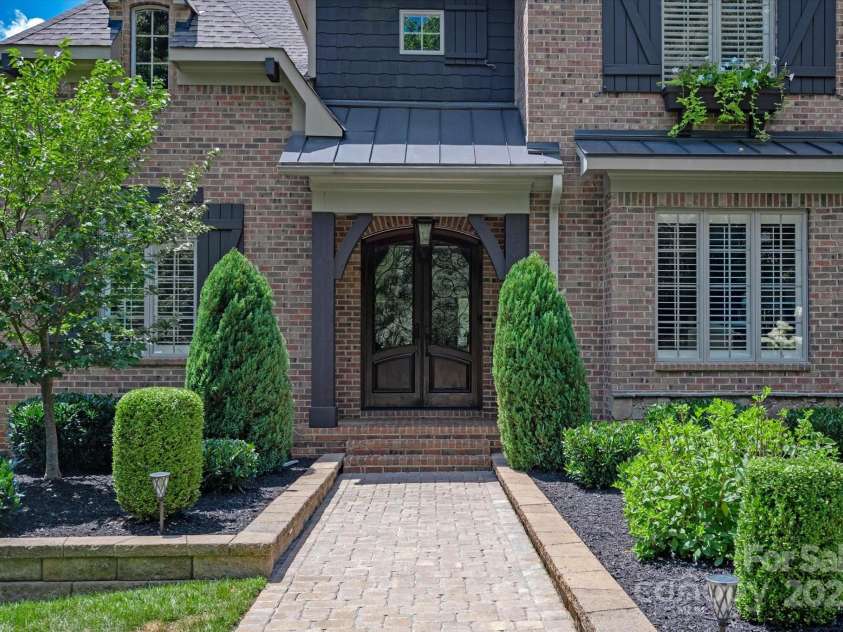 1100 Seminole Drive, Indian Land, SC 29707.  MLS# CAR4285132, YatesRealty ID 30711. Wooden double door and covered porch