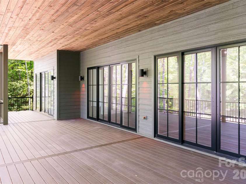99 Little Cherokee Ridge, Hendersonville, NC 28739.  MLS# CAR4375910, YatesRealty ID 30711. Lower Level Deck