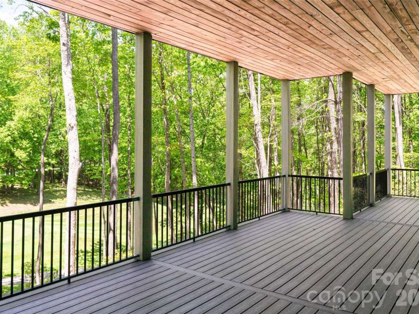 99 Little Cherokee Ridge, Hendersonville, NC 28739.  MLS# CAR4375910, YatesRealty ID 30711. Lower Level Deck