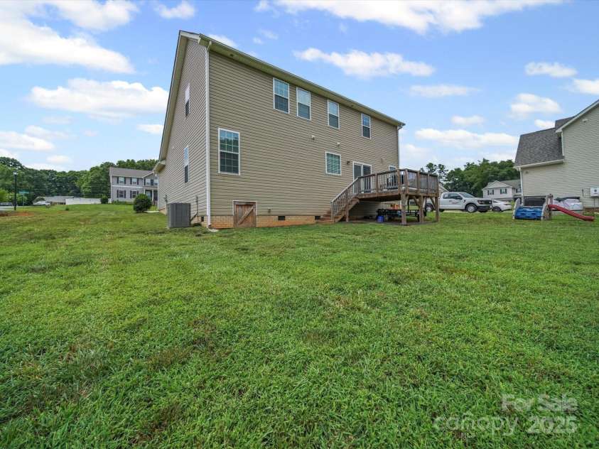 8810 Crape Myrtle Drive, Stanfield, NC 28163.  MLS# CAR4279417, YatesRealty ID 30712. Expansive backyard