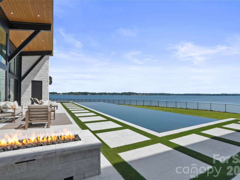22554 John Gamble Road, Cornelius, NC 28031.  MLS# CAR4388658, YatesRealty ID 30713. Firepit Poolside