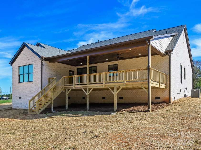 4539 Polk Ford Road, Stanfield, NC 28163.  MLS# CAR4197453, YatesRealty ID 3072. Elevated Open Covered Wood Porch