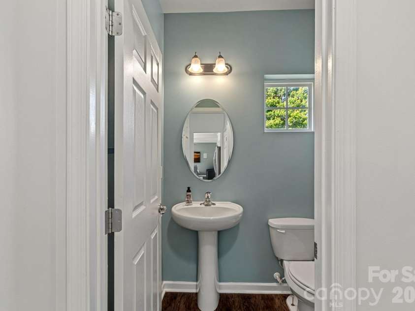 442 Almora Loop, Mooresville, NC 28115.  MLS# CAR4385982, YatesRealty ID 30720. Half bath off of the kitchen on main level