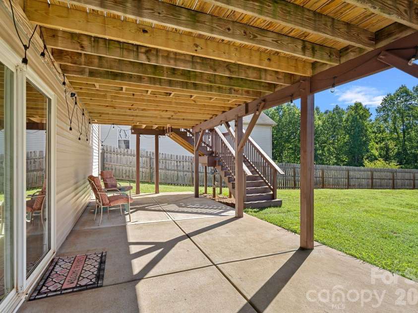 442 Almora Loop, Mooresville, NC 28115.  MLS# CAR4385982, YatesRealty ID 30720. Walkout extended concrete patio from basement