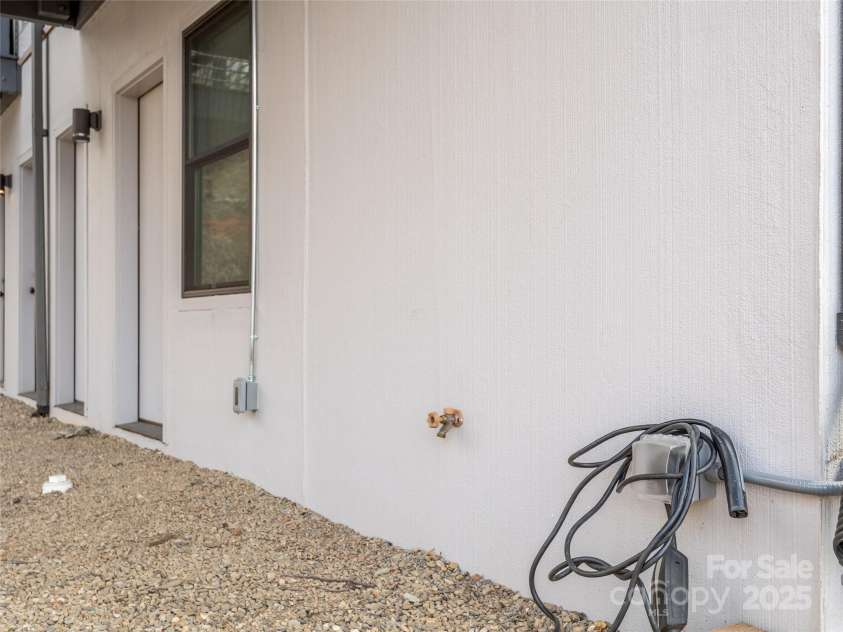 433 Haywood Street, Asheville, NC 28801.  MLS# CAR4231166, YatesRealty ID 30722. Exterior 220 outlet ready for electric car charger.