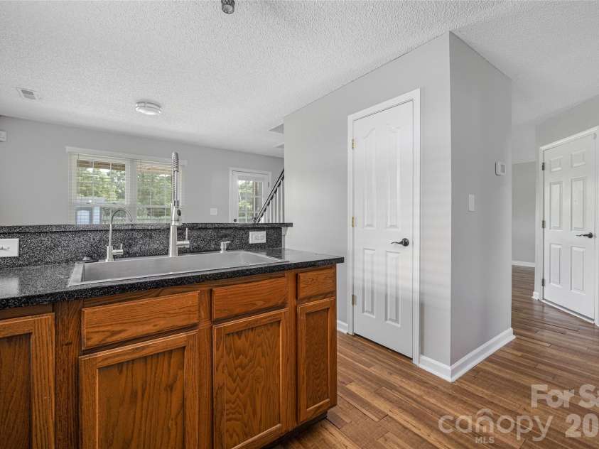 9535 Forest Path Drive, Charlotte, NC 28269.  MLS# CAR4388115, YatesRealty ID 30726. Kitchen with breakfast bar