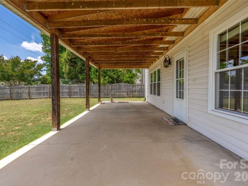 9535 Forest Path Drive, Charlotte, NC 28269.  MLS# CAR4388115, YatesRealty ID 30726. Large covered back patio
