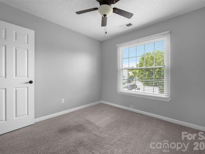 9535 Forest Path Drive, Charlotte, NC 28269.  MLS# CAR4388115, YatesRealty ID 30726. Secondary bedroom 1