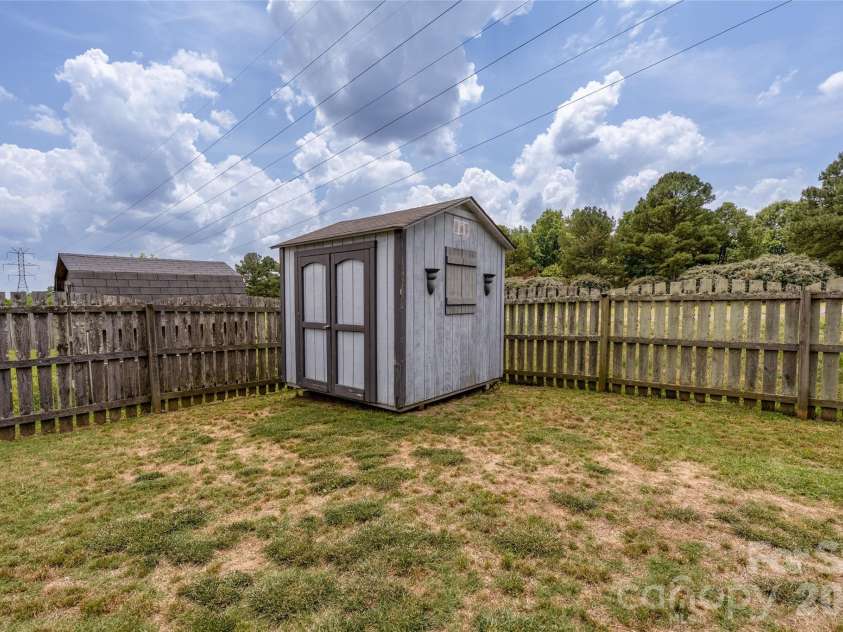 9535 Forest Path Drive, Charlotte, NC 28269.  MLS# CAR4388115, YatesRealty ID 30726. Shed in back yard