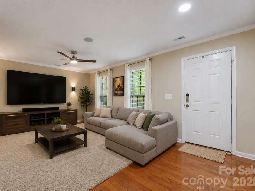 18533 The Commons Boulevard, Cornelius, NC 28031.  MLS# CAR4374906, YatesRealty ID 30727. Lower Level: Digitally Staged as an Entertainment Room