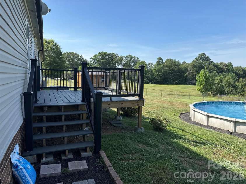 2567 Peeler Road, Vale, NC 28168.  MLS# CAR4389141, YatesRealty ID 30730. Back porch to pool