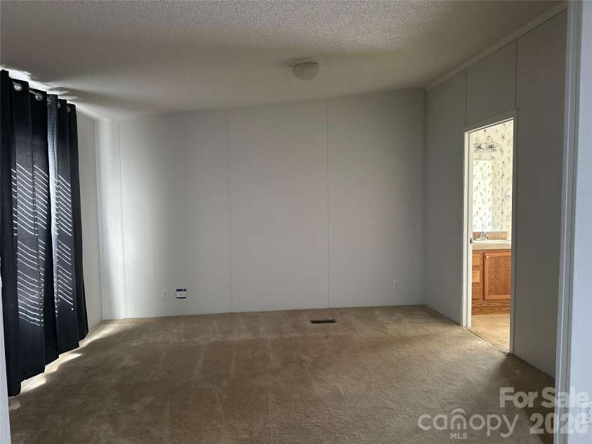 2567 Peeler Road, Vale, NC 28168.  MLS# CAR4389141, YatesRealty ID 30730. Sitting area in primary bedroom
