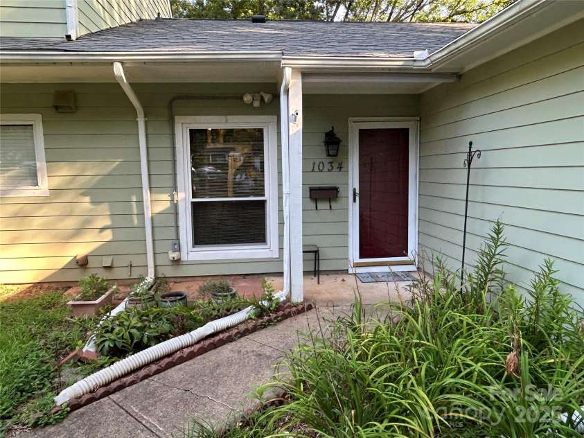 1034 Sardis Cove Drive, Charlotte, NC 28270.  MLS# CAR4288029, YatesRealty ID 30735. Front view.  Main entrance.