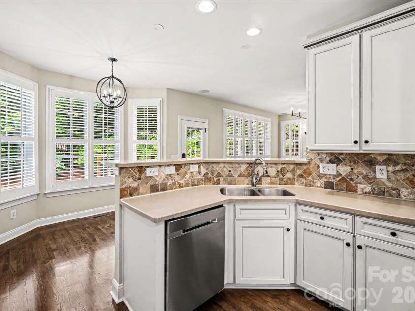 2848 Arrowwood Lane, Rock Hill, SC 29732.  MLS# CAR4386253, YatesRealty ID 30737. Solid surface countertops, tile backsplash and custom cabinetry in the kitchen