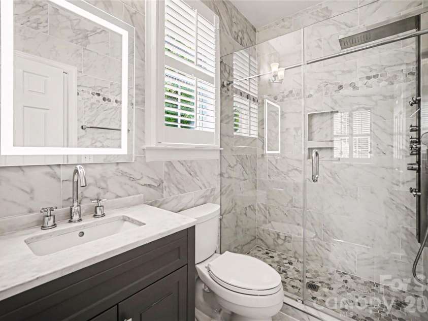 2848 Arrowwood Lane, Rock Hill, SC 29732.  MLS# CAR4414290, YatesRealty ID 30737. Main level guest features a stunning fully bathroom