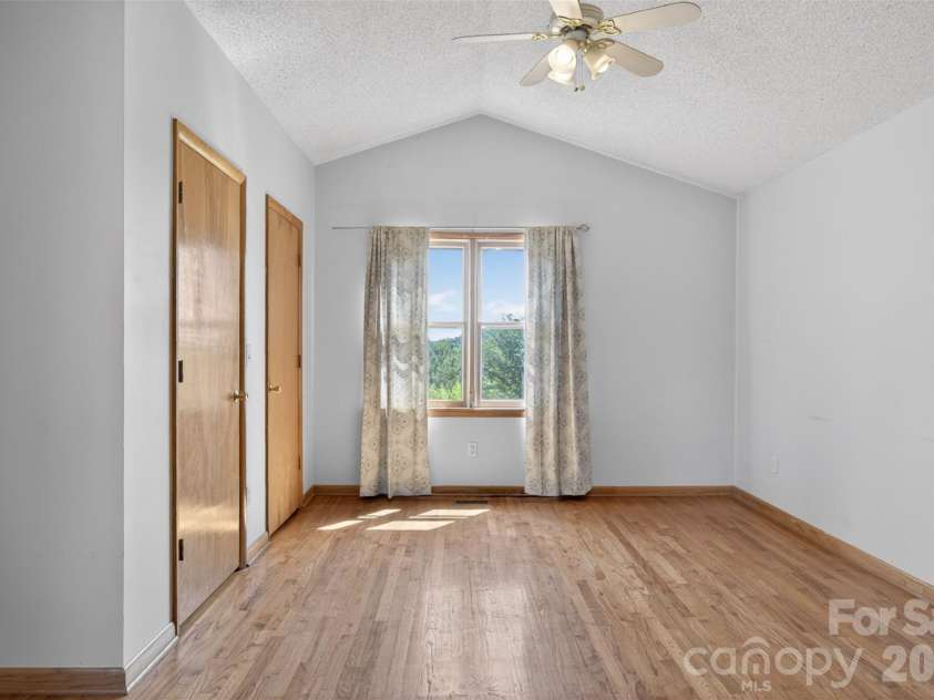 66 Misery Ridge None, Mill Spring, NC 28756.  MLS# CAR4386144, YatesRealty ID 30739. Primary Suite with cathedral ceiling has en-suite bath