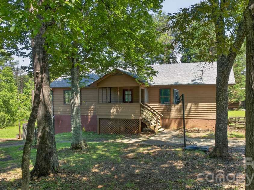 66 Misery Ridge None, Mill Spring, NC 28756.  MLS# CAR4386144, YatesRealty ID 30739. This charming ranch-style home features a spacious apartment in the full basement, perfect for guests or rental income. Enjoy the benefits of single-level living while having additional space for family or potential