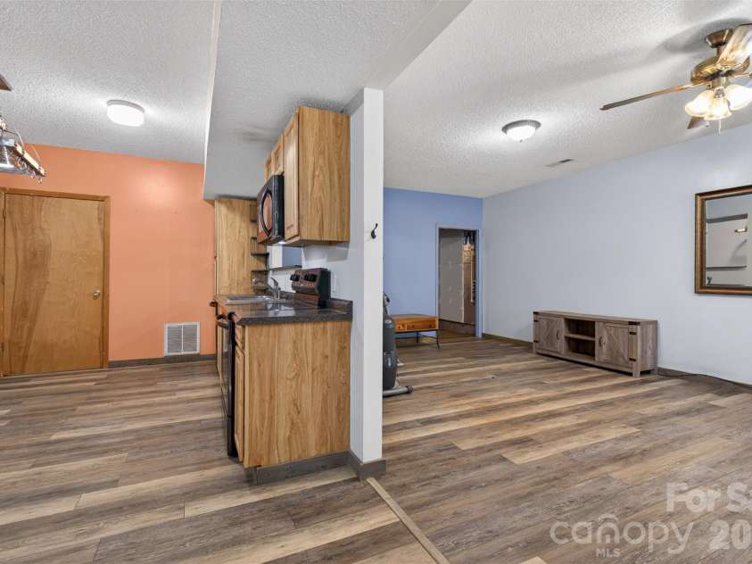 66 Misery Ridge None, Mill Spring, NC 28756.  MLS# CAR4386144, YatesRealty ID 30739. To the right is the great room