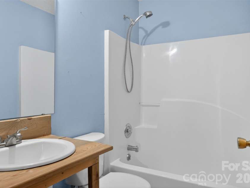 66 Misery Ridge None, Mill Spring, NC 28756.  MLS# CAR4386144, YatesRealty ID 30739. View of Hall Bath serves bedroom 2