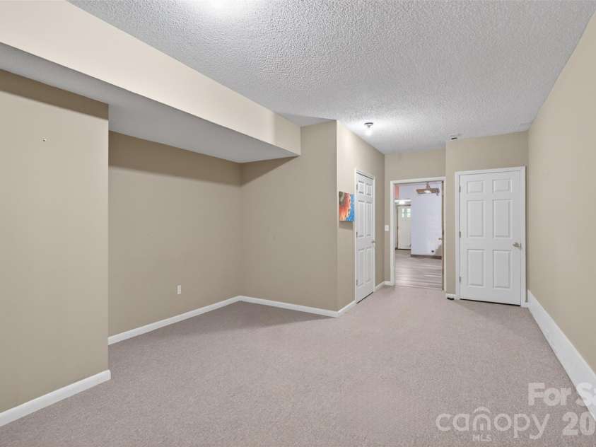 66 Misery Ridge None, Mill Spring, NC 28756.  MLS# CAR4386144, YatesRealty ID 30739. View toward entry of Bonus Room 2