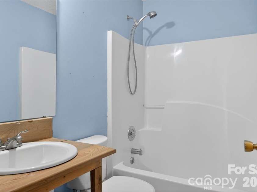 66 Misery Ridge Trail, Mill Spring, NC 28756.  MLS# CAR4385906, YatesRealty ID 30739. View of hall bath serves bedroom 2.